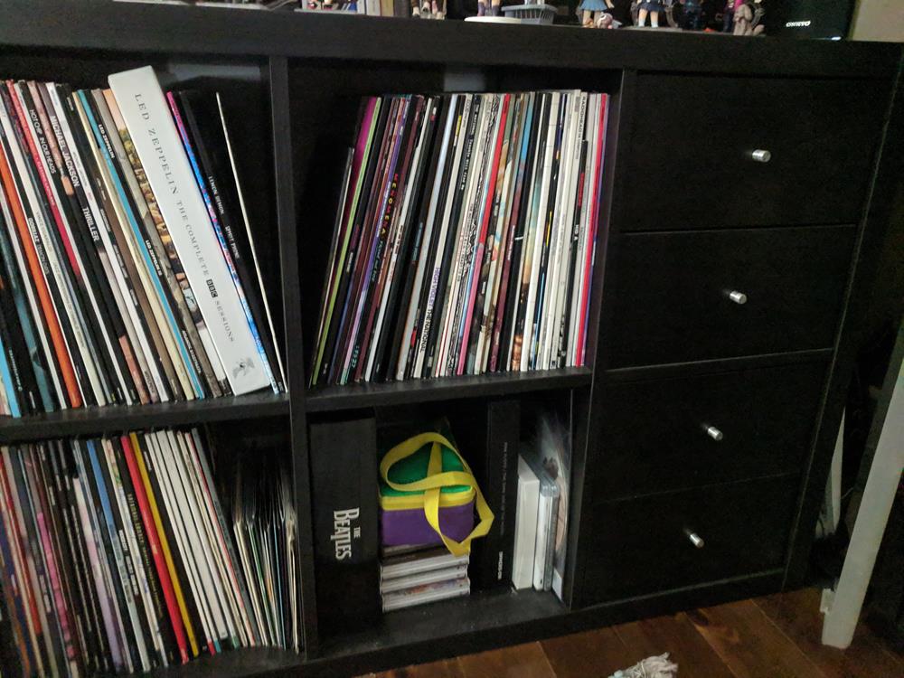 Shelf of vinyl records and miscellaneous music