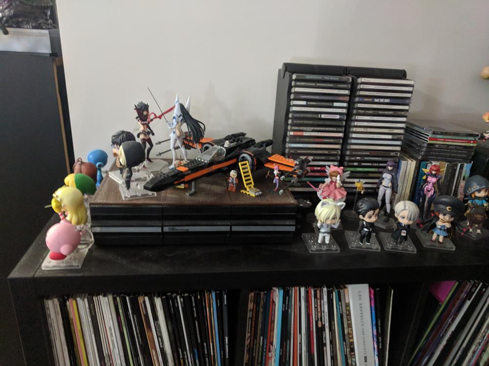 Shelf top with CD racks, cassette tape rack, anime figures, lego